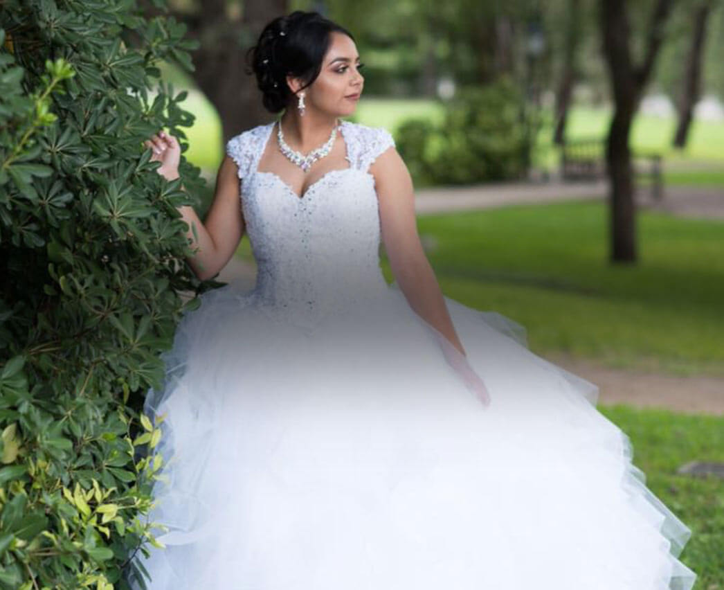 Model wearing a white gown