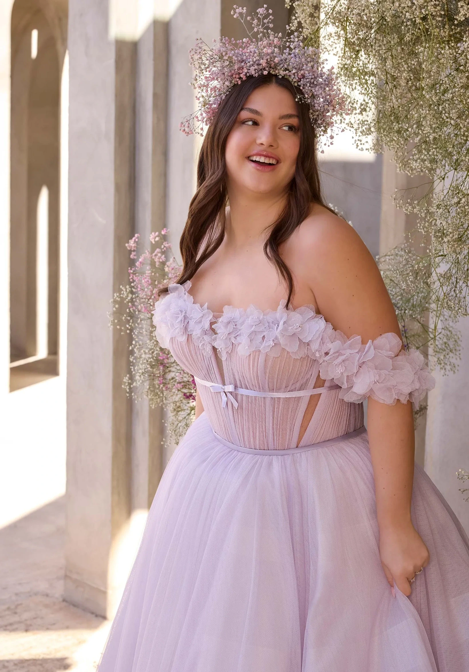 Model wearing a plus size dress